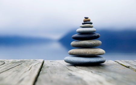 zen-balancing-pebbles-misty-lake